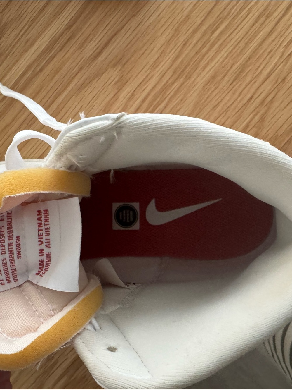 Nike White High-Top Sneakers with Red Insole and Yellow Tongue Accent